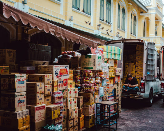 Assorted boxes staged for loading, representing in-bond freight moving to a sufferance warehouse