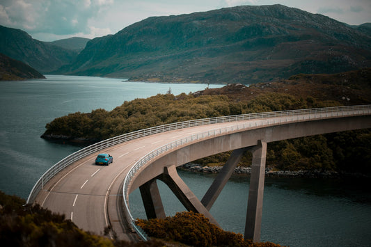 Truck crossing a bridge during daylight