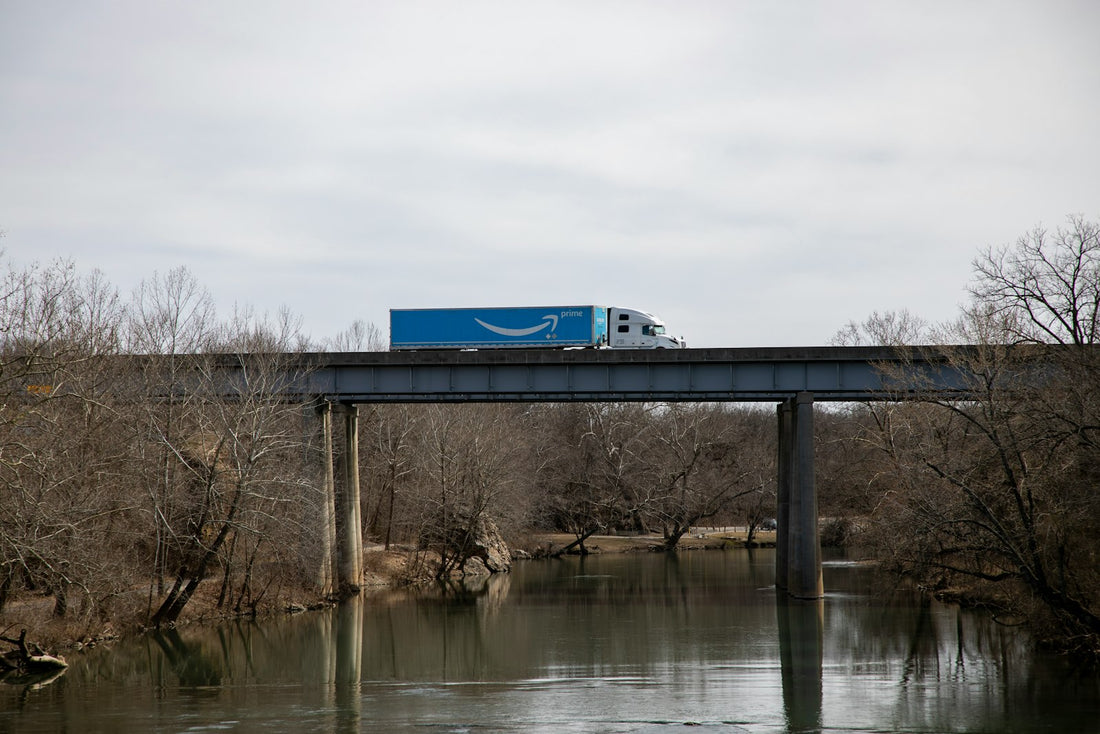 Truck crossing a bridge on a Canada-US highway freight corridor