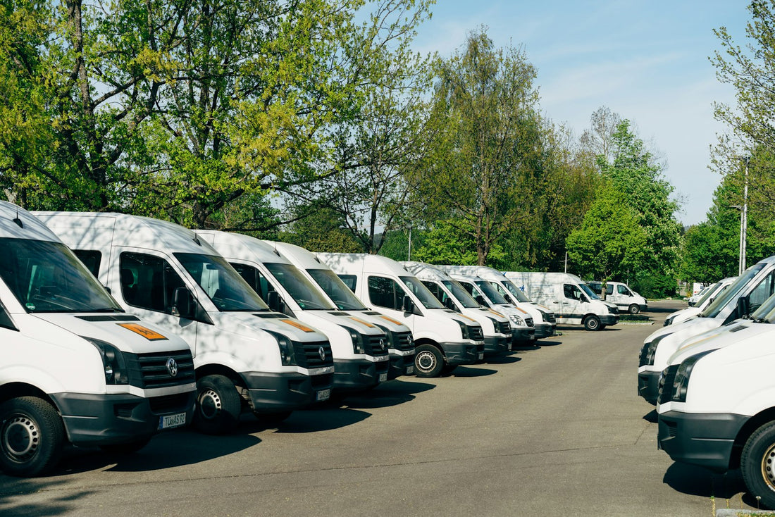 cars parked on parking lot during daytime — cross-border freight (Unsplash, Markus Winkler)