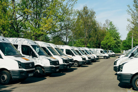 cars parked on parking lot during daytime — cross-border freight (Unsplash, Markus Winkler)