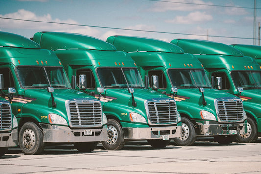Fleet of freight trucks parked, representing a CSA-approved carrier serving Canadian importers